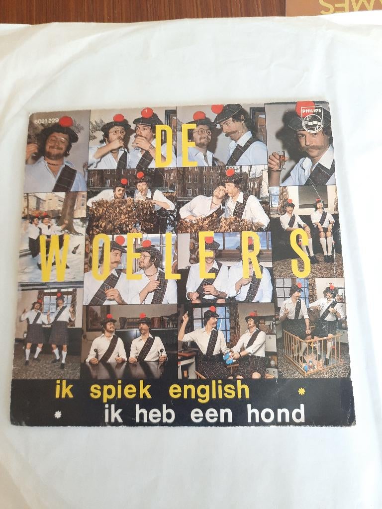 De woelers- Ik spiek English/ik heb een hond., CD & DVD, Vinyles | Néerlandophone, Enlèvement ou Envoi, Pochette photo, 7 inch