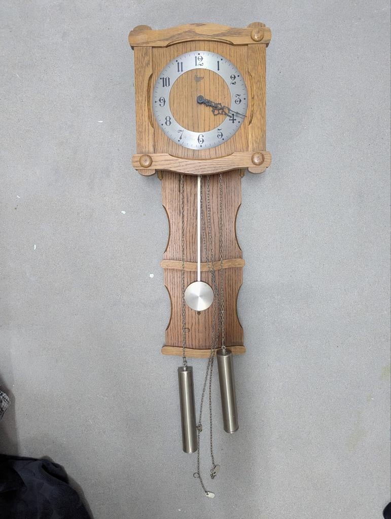 Houten hangklok, Ophalen