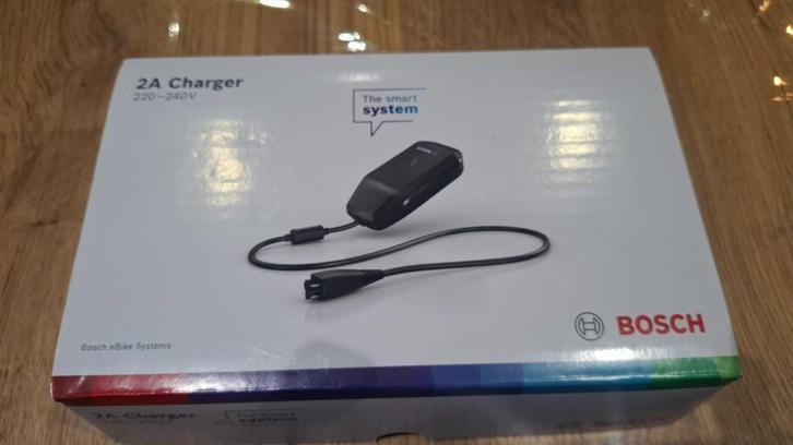 Bosch smart charger 2A *nieuw*, Fietsen en Brommers, Fietsaccessoires | Fietsaccu's, Nieuw, Ophalen of Verzenden