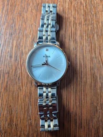 Fossil Lux Luther dameshorloge met een tweekleurige roestvri beschikbaar voor biedingen