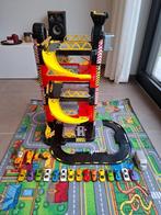 Parkeergarage met mat en set auto's, Ophalen