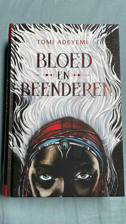 Tomi Adeyemi - Bloed en beenderen, Boeken, Kinderboeken | Jeugd | 13 jaar en ouder, Zo goed als nieuw, Ophalen of Verzenden