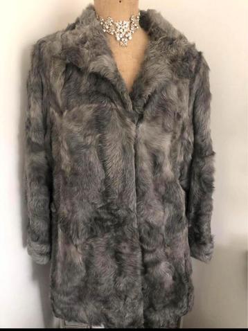 Warme jas/ midden grijs/ maat 46-48/€35 beschikbaar voor biedingen