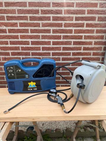 Draagbare compressor + persluchthaspel beschikbaar voor biedingen