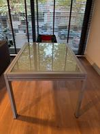 Design uitschuifbare tafel met glazen blad en metalen poten, Huis en Inrichting, Tafels | Eettafels, Ophalen, 100 tot 150 cm, Design