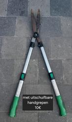 Snoeischaar met telescopische handvaten, Ophalen