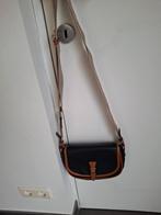 Schoudertas, Ophalen