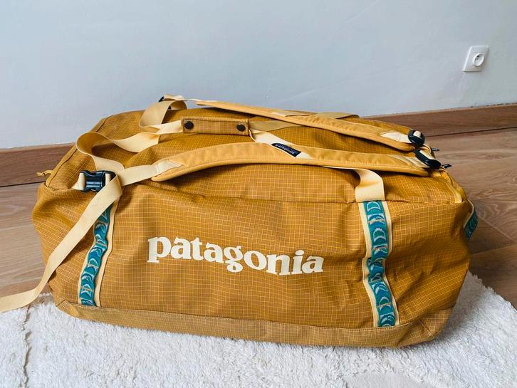 Duffel bag reistas 70 liter Patagonia donkergeel, Handtassen en Accessoires, Tassen | Reistassen en Weekendtassen, Zo goed als nieuw