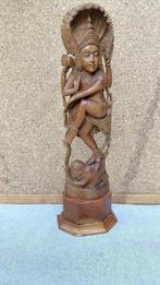 Indonesie houten beeld, Ophalen