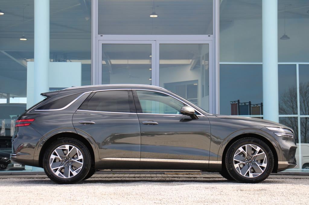 Genesis GV70 PURE 84 kWH Dual Motor AWD 490PK *FULL OPTION*, Auto's, Genesis, Automaat, 479 km, Leder, SUV of Terreinwagen