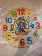Houten klok puzzel, Ophalen