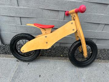 Houten loopfiets te koop beschikbaar voor biedingen