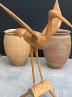 Grote houten vogel, Ophalen