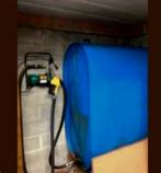 Mazouttank met pomp en pistool., Ophalen