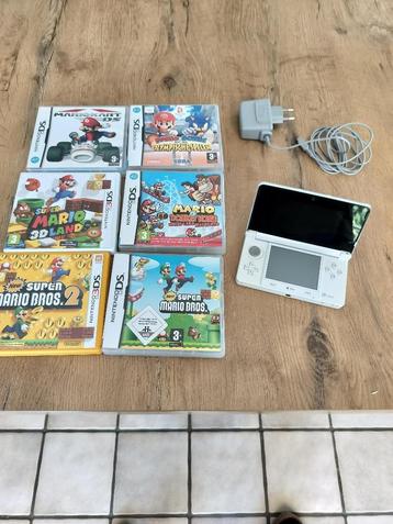 Nintendo 3DS en 6 spelletjes mario beschikbaar voor biedingen