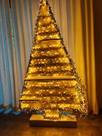 Houten kerstboom, Ophalen