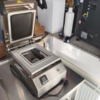 Machine voor het sluiten van voedseldozen, Enlèvement