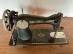 Antieke Singer naaimachine, Ophalen