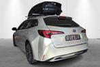 Toyota Corolla Touring Sports 1.8 Hybrid Style e-CVT - NIEUW, Auto's, 4 cilinders, Corolla, 140 pk, Zilver of Grijs