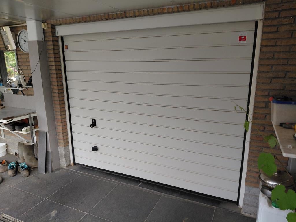 Sectionale poort garagepoort, Ophalen