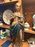 18 de eeuwse houten beeld, Ophalen