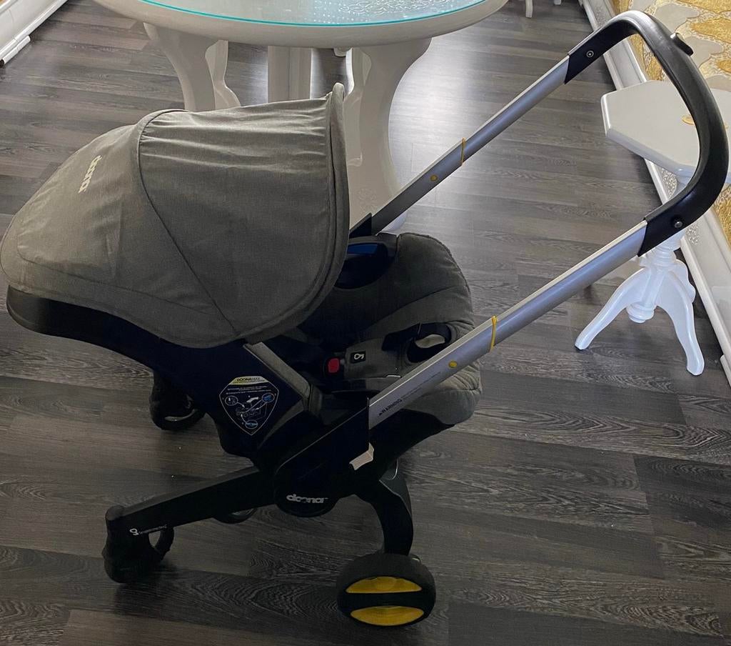 Doona kinderwagen-grijs met originele accesoires., Ophalen, Gebruikt, Overige merken, Regenhoes