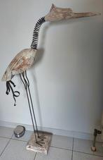 Reiger op sokkel., Ophalen