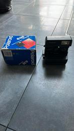 Polaroid 636 instantcamera van dichtbij, Ophalen