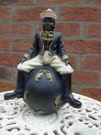 standbeeld van een zwarte man zittend op een bal, art deco.., Antiek en Kunst, Ophalen of Verzenden