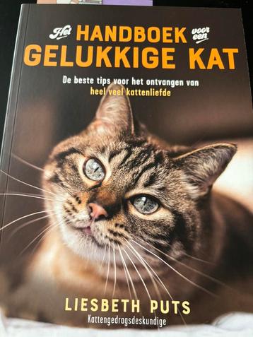 Boek: het handboek voor een gelukkige kat  disponible aux enchères