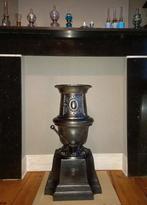 Poêle à charbon en fonte, Enlèvement