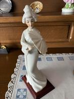 Mooi beeldje Aziatische vrouw, Ophalen