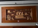 Grote houten muurversiering, Ophalen