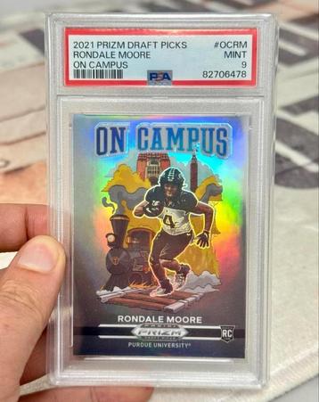 2021 PRIZM DRAFT PICKS RONDALE MOORE ON CAMPUS panini PSA-9 beschikbaar voor biedingen