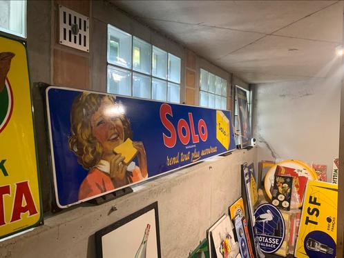 Emaille Reclamebord SOLO 246,5 x 47 uit 1954, Verzamelen, Merken en Reclamevoorwerpen, Gebruikt, Reclamebord, Ophalen
