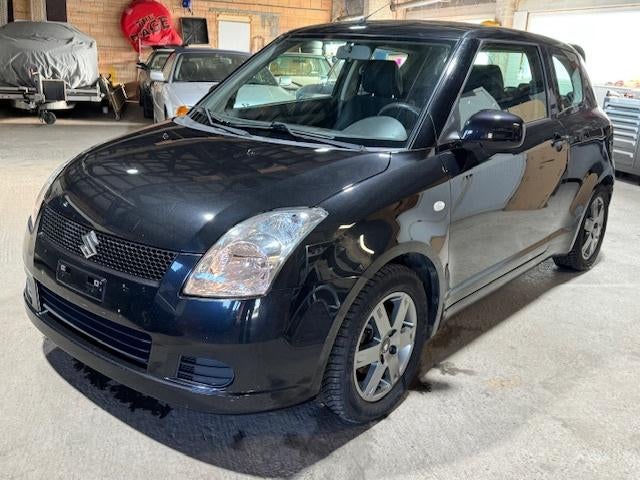 Suzuki Swift benzine Airco, Voorwielaandrijving, Stof, Zwart, 1328 cc