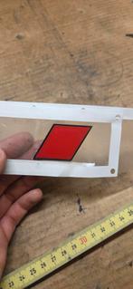 Rood met zwarte Audi badge, Ophalen