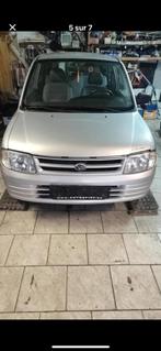 Benzine-auto te koop, Auto's, Daihatsu, Voorwielaandrijving, 4 zetels, Stof, Zwart