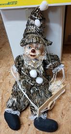 Clown porcelaine avec balançoire