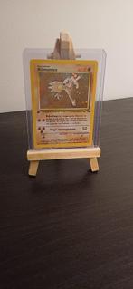 Pokémon Hitmonlee - Fossil - First edition, Ophalen of Verzenden, Zo goed als nieuw, Losse kaart, Foil