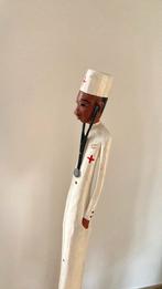 Statuette medecin, Ophalen