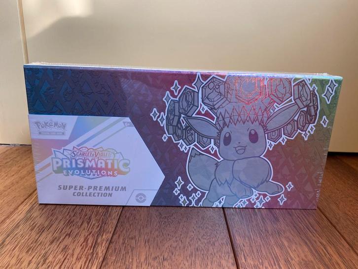 Prismatic Evolutions Super-Premium Collection (SEALED), Hobby en Vrije tijd, Verzamelkaartspellen | Pokémon, Nieuw, Losse kaart