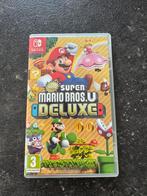 Super Mario Bros U Deluxe Nintendo Switch, Consoles de jeu & Jeux vidéo, Jeux | Nintendo Switch, Comme neuf, À partir de 3 ans
