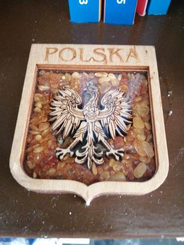 Armoiries de la Pologne sur un lit de