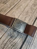 Uniform broeksriem van Scouts en Gidsen Vlaanderen., Deze riem is verkrijgbaar in verschillende maten.

Verstelbaar zonder gaatjes.

De metalen gesp kan op maat geschoven worden