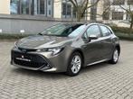Toyota Corolla Hybrid e-CVT Dynamic Plus bedrijfspakket, Te koop, Stadsauto, 5 deurs, Stof
