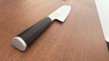 Kai Santoku Japans Damascus 18 cm + Steen en accessoires  beschikbaar voor biedingen
