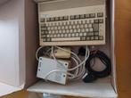 Te koop Amiga 600, de bovenkant is vergeeld door het weer, Ophalen of Verzenden