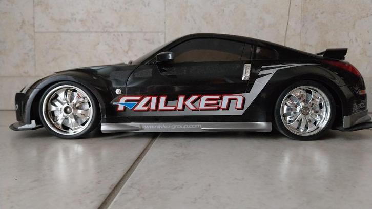 Radiogestuurde Nissan Nikko racewagen, Kinderen en Baby's, Speelgoed |Speelgoedvoertuigen, Zo goed als nieuw, Afstandsbediening