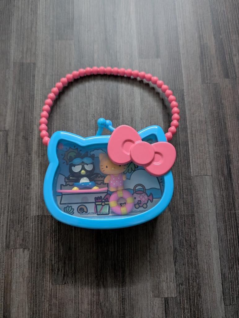 Hello Kitty popjes met handtas, Ophalen
